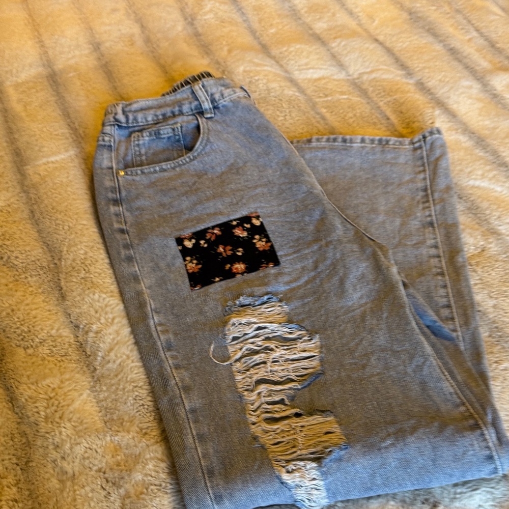 Distressed Light Blue Jeans with Floral Patch